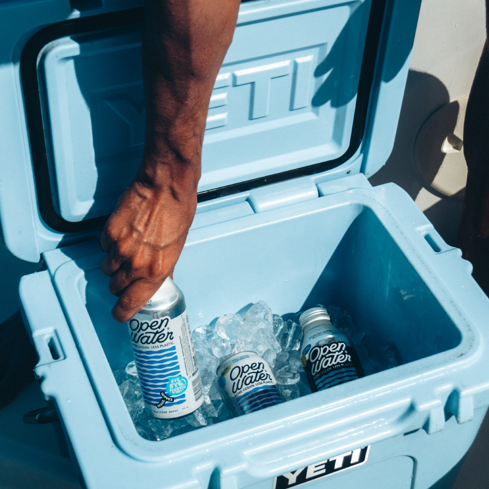 canned water in cooler with ice