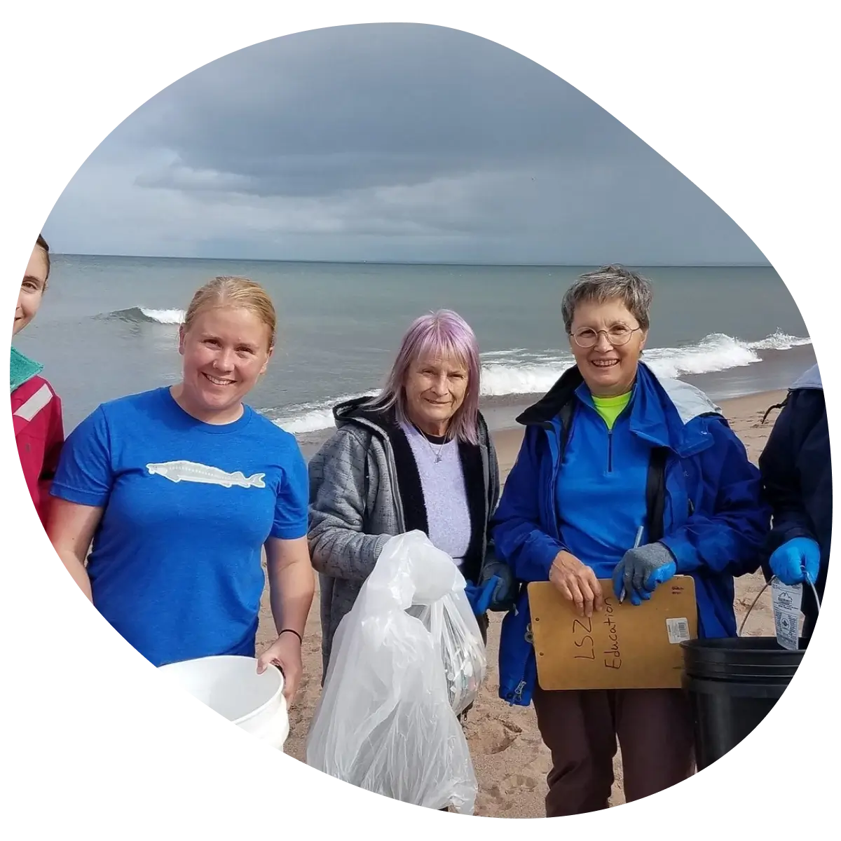 people doing a cleanup at the beach